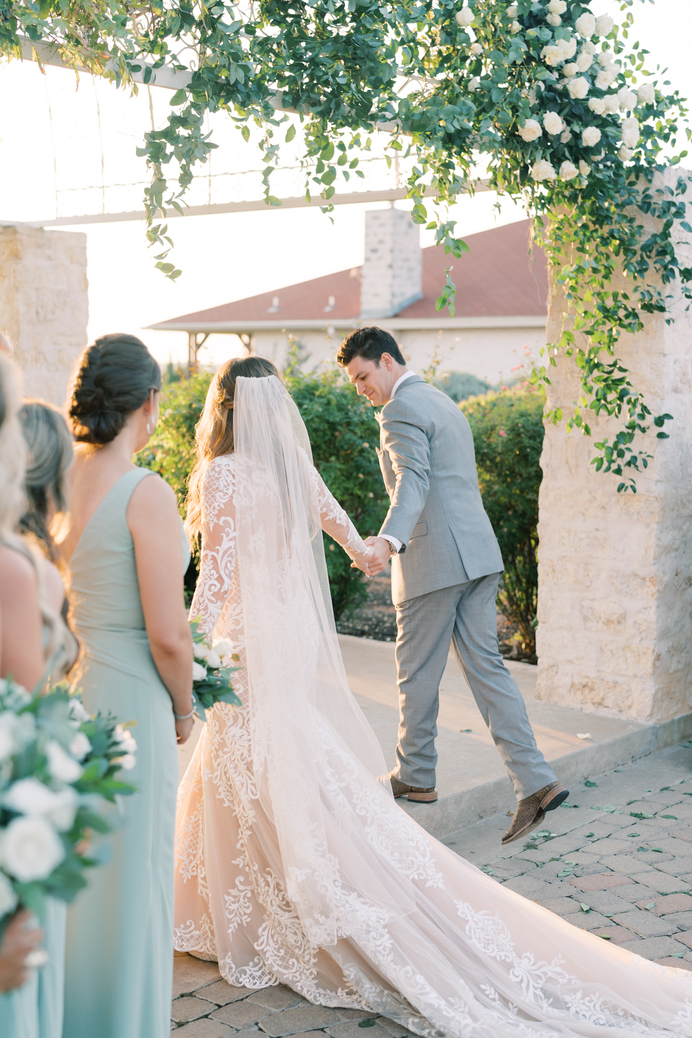 Jac's boho sheer, form fitting lace dress with gorgeous long sleeves is to die for! Their wedding day at Vintage Villas in Lakeway TX (near Austin) has the most beautiful sunset overlooking the water. You have to see for yourself! 