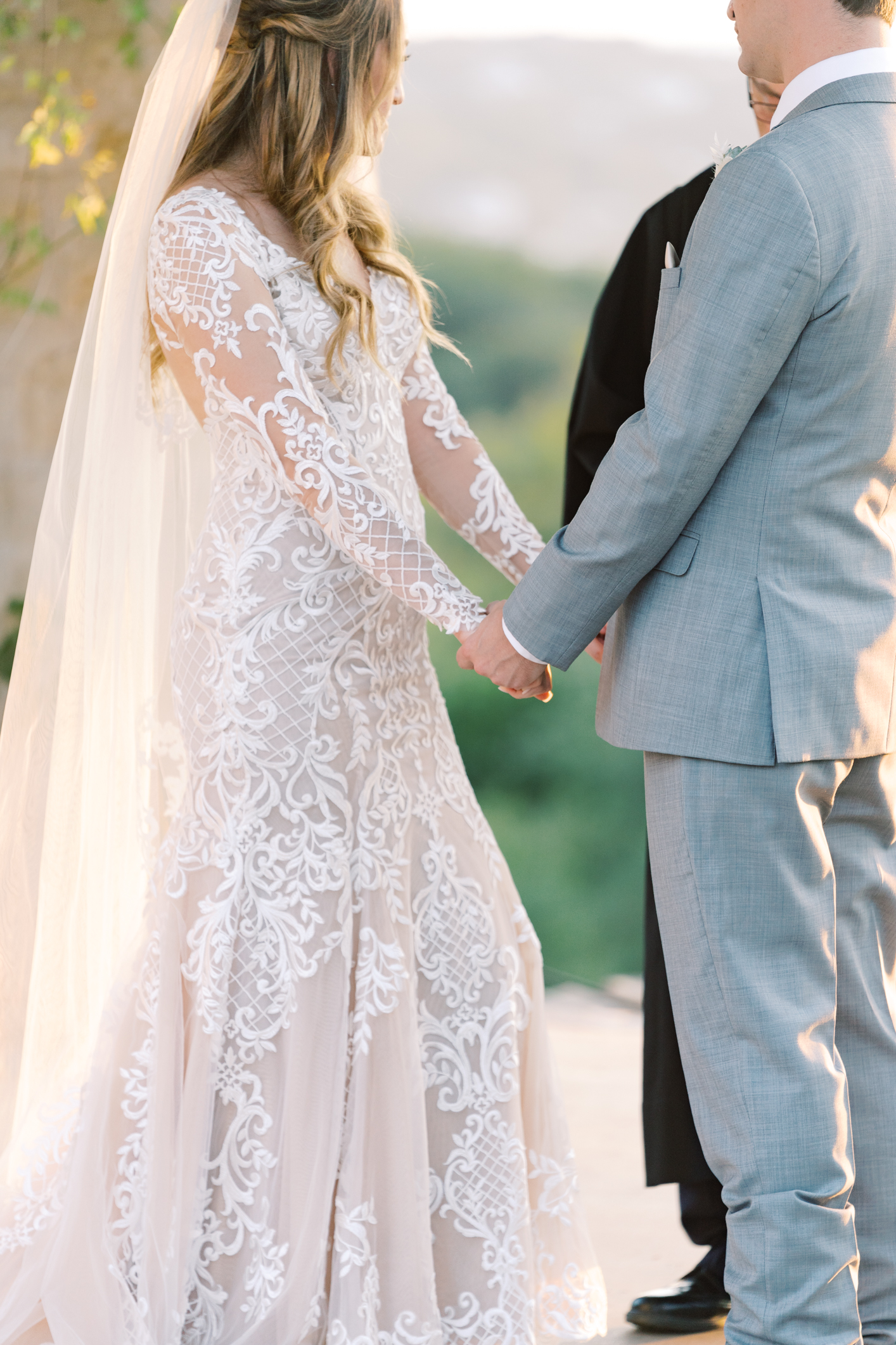 Jac's boho sheer, form fitting lace dress with gorgeous long sleeves is to die for! Their wedding day at Vintage Villas in Lakeway TX (near Austin) has the most beautiful sunset overlooking the water. You have to see for yourself! 