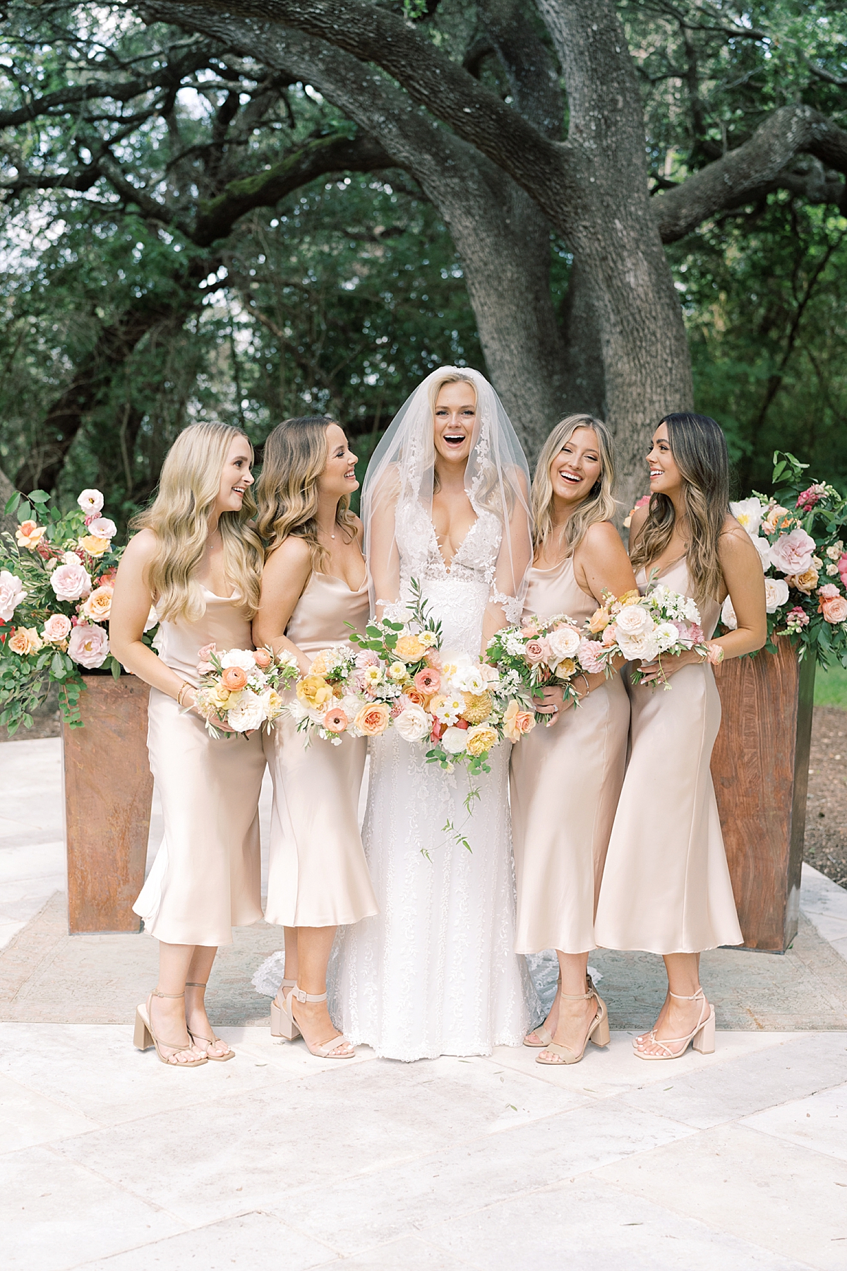 "We have chosen Texas as our home, and even though we aren't from here, we've absolutely loved living here and wanted to honor our chosen home on our day with a little western flair." A custom horseshoe logo, bolo ties, and cowboy boots encouraged..! This super fun western Mercury Hall Wedding was one for the books! Click through to see all of their fun custom wedding details!