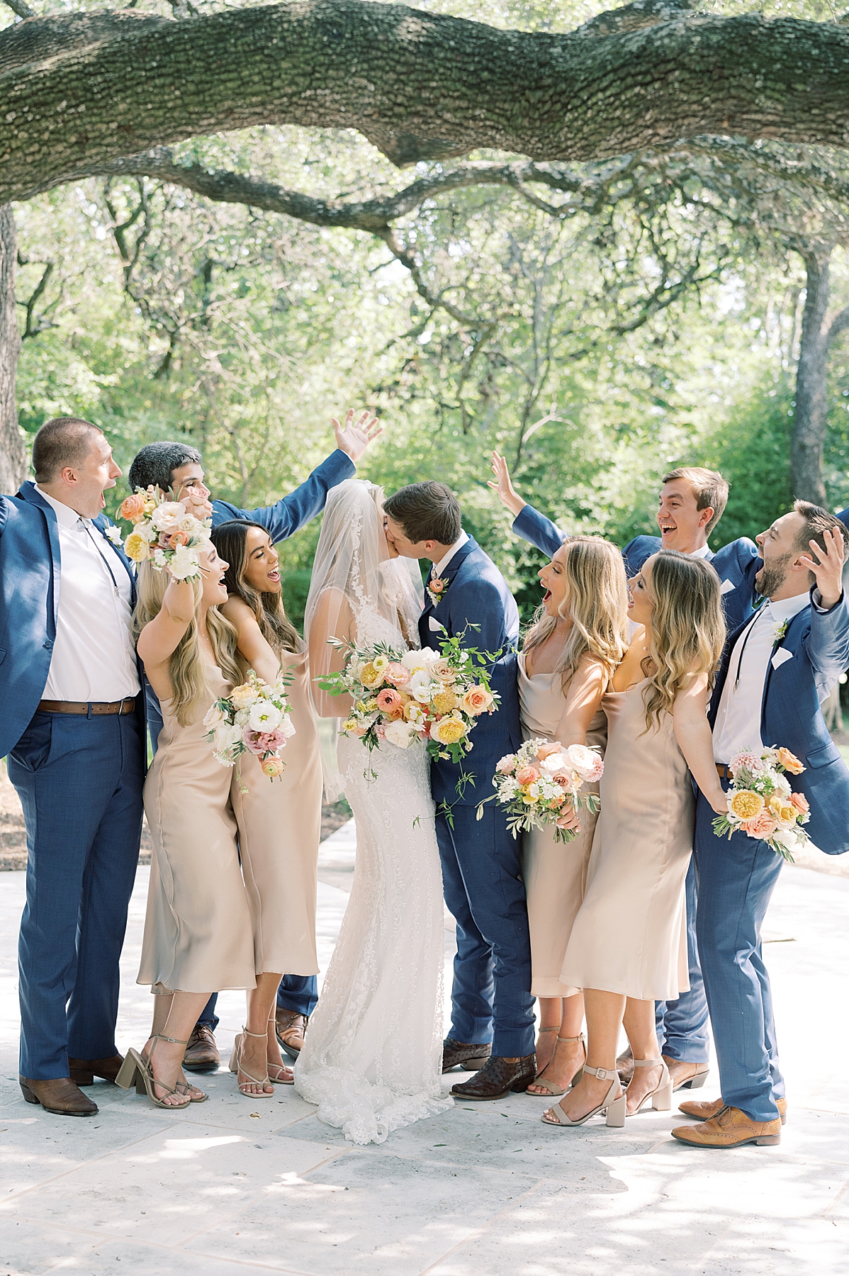 "We have chosen Texas as our home, and even though we aren't from here, we've absolutely loved living here and wanted to honor our chosen home on our day with a little western flair." A custom horseshoe logo, bolo ties, and cowboy boots encouraged..! This super fun western Mercury Hall Wedding was one for the books! Click through to see all of their fun custom wedding details!