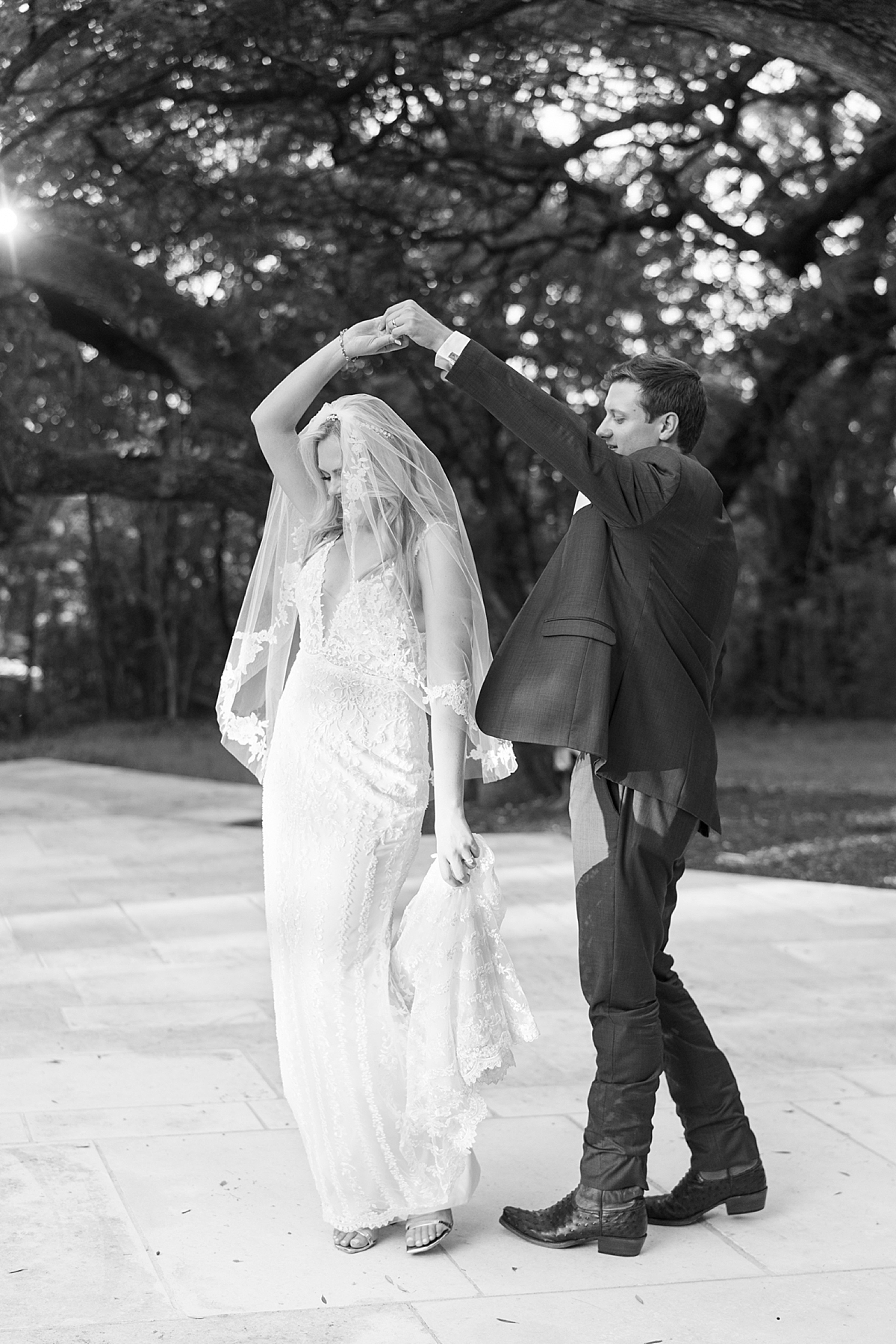 "We have chosen Texas as our home, and even though we aren't from here, we've absolutely loved living here and wanted to honor our chosen home on our day with a little western flair." A custom horseshoe logo, bolo ties, and cowboy boots encouraged..! This super fun western Mercury Hall Wedding was one for the books! Click through to see all of their fun custom wedding details!